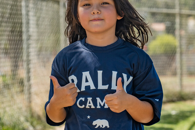 Camper wearing blue Rally Camp shirt